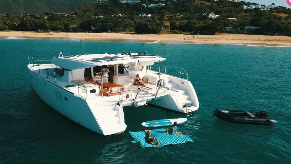 The New Life catamaran at anchor off a beach in St Martin