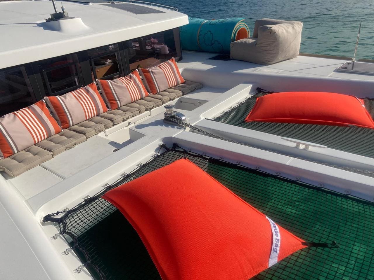 The catamaran's bow nets with cushions and sun loungers
